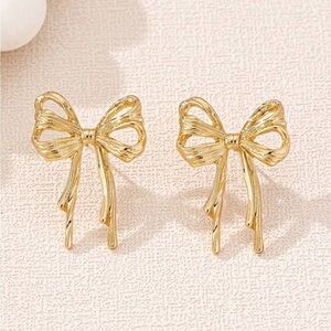 Double bow gold stud earrings soft girl era 2026 trendy season